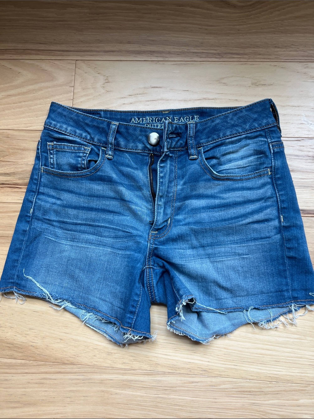 American Eagle Outfitters Distressed Blue Denim Cutoff Shorts.